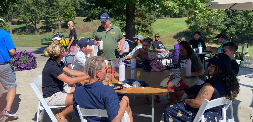 employees around outside table